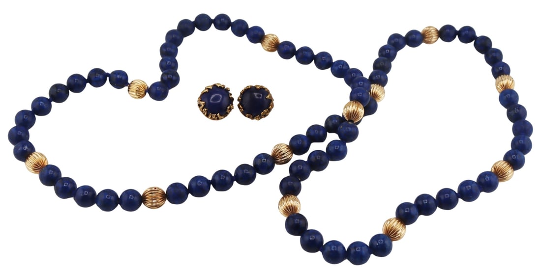 JEWELRY. Lapis Lazulis and Gold Jewelry Grouping.: Lapis Lazulis beaded necklace accented by 13.5kt ribbed yellow gold beads with a 13.5kt yellow gold mystery clasp. Accompanied by a pair of organic form 13kt yellow gold mounted Lapis Lazulis clip-on 