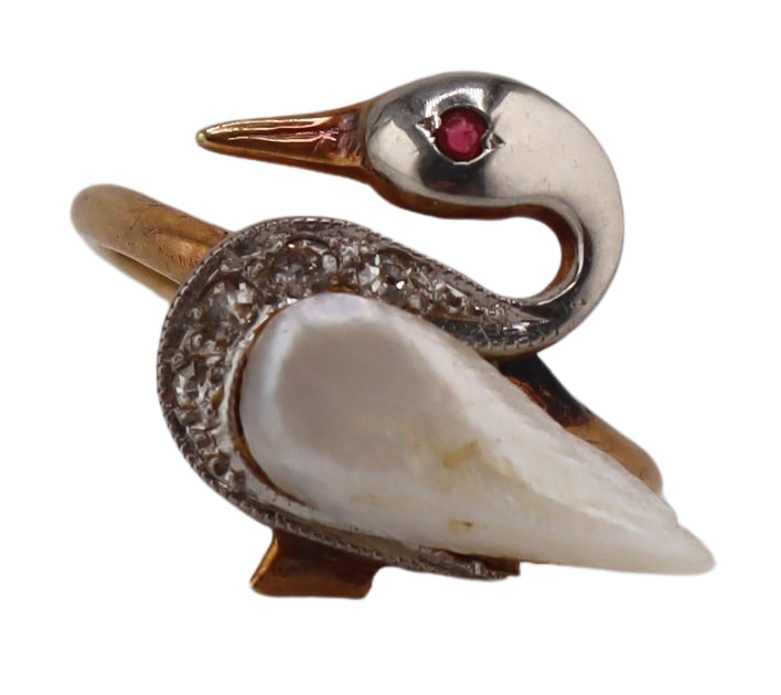 JEWELRY. Swan Diamond Pearl and Ruby Ring.: Antique 13kt yellow gold ring in the form of a swan comprised of an elongated keshi pearl perfectly shaped as a wing, a platinum mounted head, pave diamond accents and single round ruby eye. Apparentl