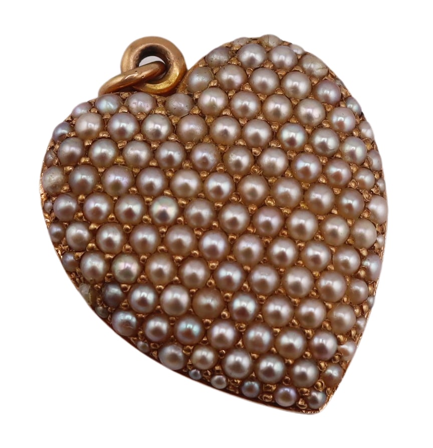 JEWELRY. Antique 14kt Gold and Seed Pearl Heart: Locket Pendant. Beautiful 14kt yellow gold heart form locket pendant inlaid throughout with seed pearls. Stamped, "14" to the interior of the locket with an unidentified pictorial hallmark/maker's mar