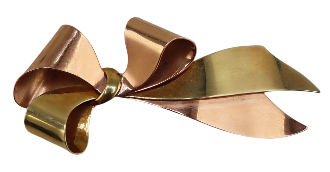 JEWELRY. 14kt Gold Two-tone Bow Form Brooch.: A 14kt yellow and rose gold bow form brooch - stamped, "14K". Total approx. weight of both items is 6.5 dwt (gross). From a Bronxville, NY estate. Dimensions: item measures approx. 2.50" in length.