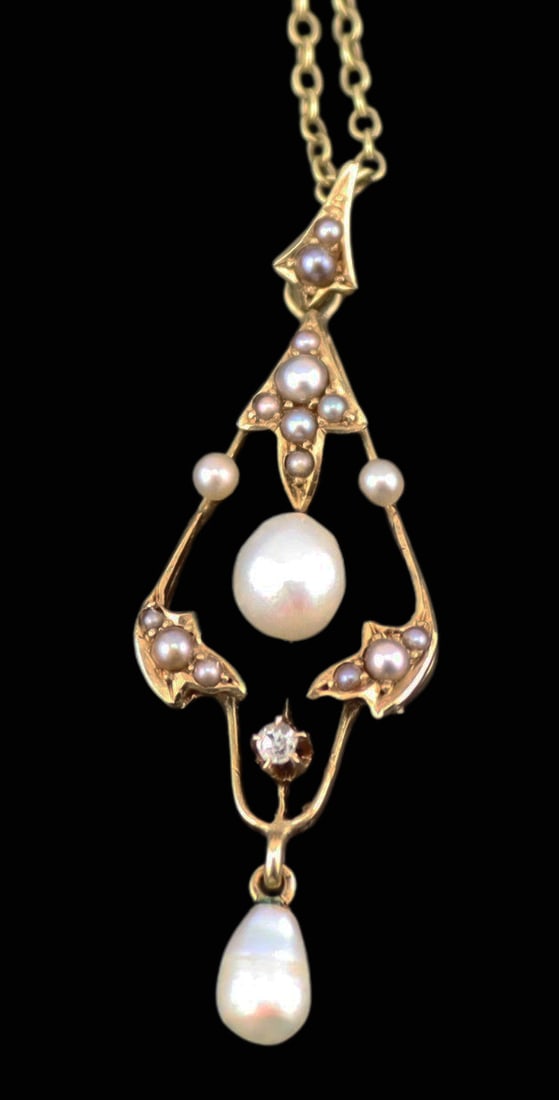 JEWELRY. 14kt Gold, Pearl, and Diamond Pendant.: A 14kt yellow gold openwork pendant accented with pearls and a single diamond, suspended from an unmarked 17kt yellow gold chain fitted with a spring ring clasp. The pendant is stamped "14K". Total