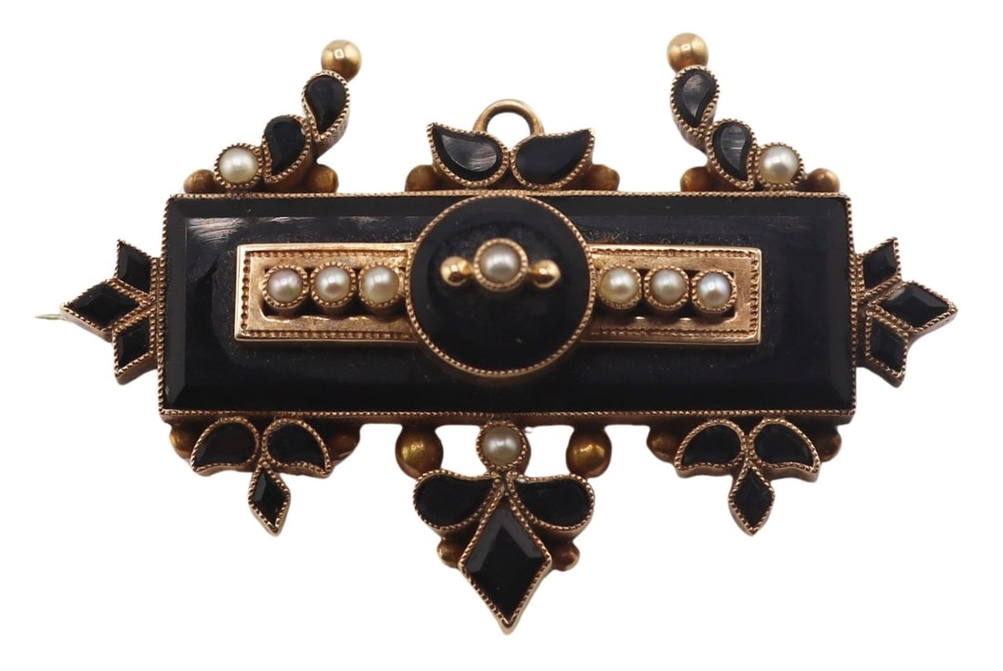 JEWELRY. Victorian 9kt Gold, French Jet, and Seed: Pearl Brooch. An unmarked late Victorian 9kt yellow gold, French jet, and seed pearl brooch. Executed in the Etruscan Revival taste, the brooch features a rectangular French jet panel centered by a ci