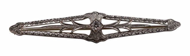 JEWELRY. 14kt Gold and Diamond Bar Pin.: A 14kt white gold open work bar pin with a central prong set diamond accent - stamped, "14K". Total approx. weight is 2.8 dwt (gross). From a Bronxville, NY estate. Dimensions: item measures approx.