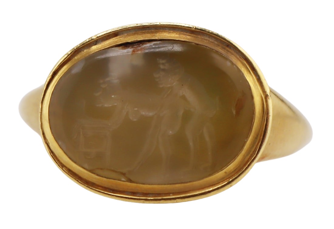 JEWELRY. Antique Gold Carved Erotic Intaglio Ring.: Antique 18kt yellow gold gold men's ring displaying a central flush set carved agate? intaglio of an erotic scene. Apparently unmarked. Total approx. weight of the ring is 7.0 dwt (gross). Ring size
