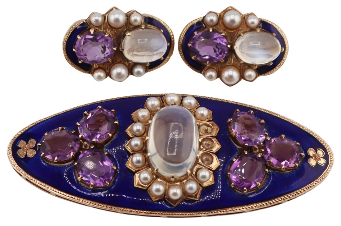 JEWELRY. 3 Pc. Moonstone, Amethyst, Pearl and: Enamel Jewelry Suite. Includes a 14kt yellow gold oblong brooch with a central oval moonstone cabochon surrounded by (13) pearls, and flanked by prong-set oval faceted amethyst trefoils. Gems are set 
