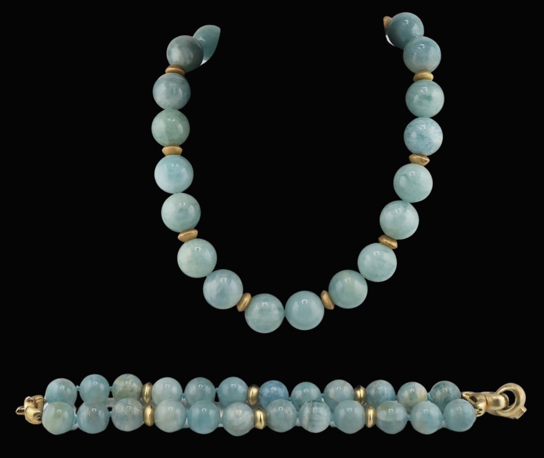 JEWELRY. 2 Pc. Aquamarine and Silver Gilt Jewelry: Suite. Includes a single strand necklace comprised of (22) round Aquamarine beads accented by (9) gilt silver rondelles and a gilt silver magnetic clasp - beads measure approx. 18.0mm each. Accompanie