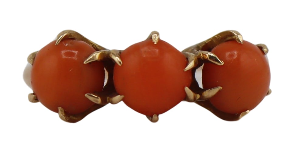 JEWELRY. Victorian 14kt Gold and Salmon Coral Ring: Victorian 14kt yellow gold ring displaying (3) prong-set polished salmon coral cabochons. Stamped, "14K" to the interior of the band. Total approx. weight of the ring is 2.2 dwt (gross). Ring size -