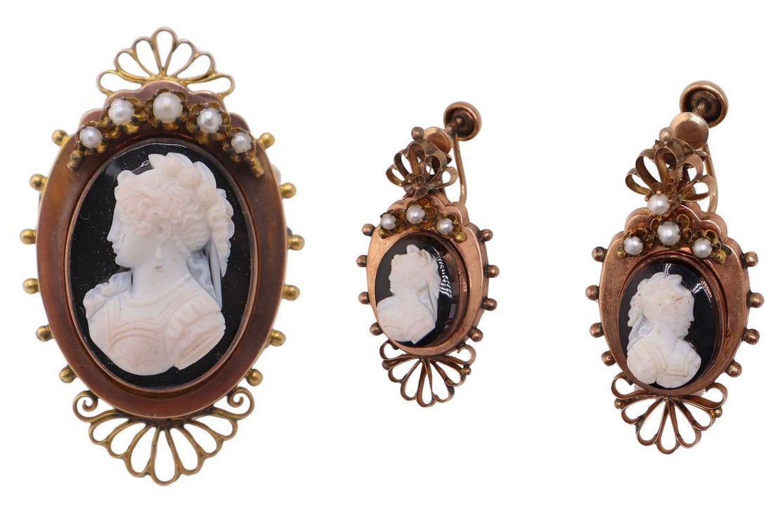 JEWELRY. 14kt Gold Cameo Brooch and Earclips: A vintage 14kt yellow and rose gold two-tone cameo brooch and matching screw back ear clips, each featuring a carved classical female profile cameo in relief against a black ground. The brooch is fram