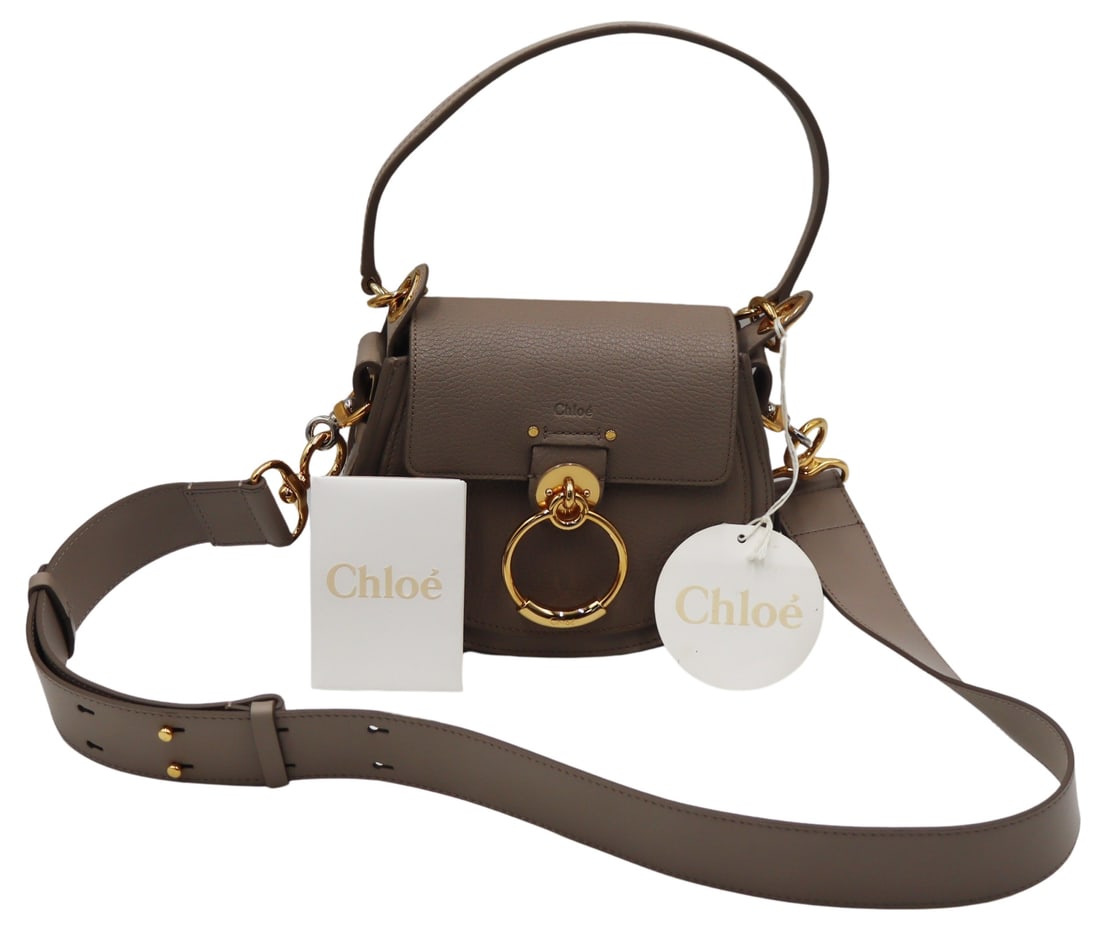 COUTURE. Chloe Small Motty Grey Camera Bag.: With gold-tone hardware, a snap closure, and two slip pockets. Purse displays an adjustable shoulder strap with a drop measuring approx. 20.5", and a shoulder strap with a drop measuring approx. 7".