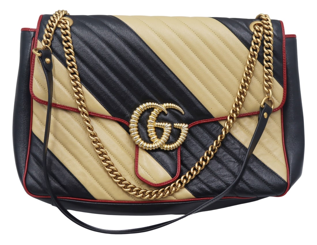 COUTURE. Gucci Double G Marmont Leather: Purse. Gucci Marmont tan and black leather purse with red leather piping, gold-tone Double-G closure, and a gold-tone chain strap with black leather shoulder guard. Tan suede interior feature a