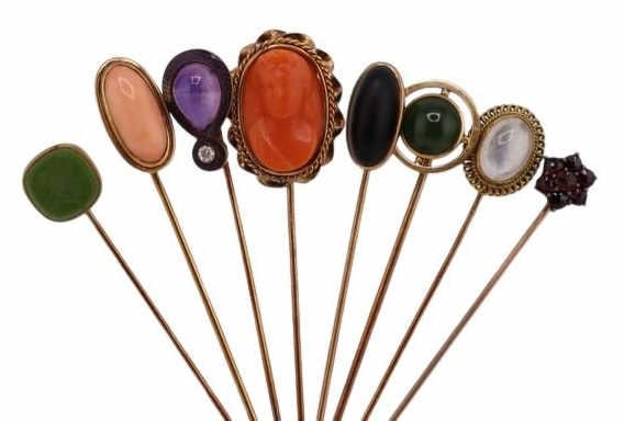 JEWELRY. (8) Assorted 14kt and 10kt Gold Stickpins: Including (1) 10kt yellow gold stickpin with a central bezel-set intaglio - stamped, "10K"; (1) 10kt yellow gold stickpin with a gold-tone cluster of prong-set red gems - pin stamped, "10K"; (1) 14kt 