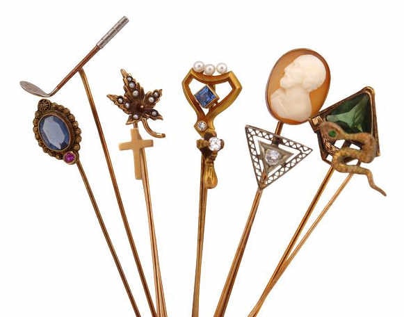 JEWELRY (10) Assorted 14kt Gold Stickpins: Including (1) stickpin with a 14kt yellow gold pin and a 10kt white gold triangular openwork head with a central diamond accent - pin stamped. "14K"; (1) 14kt yellow gold stickpin with a central bezel