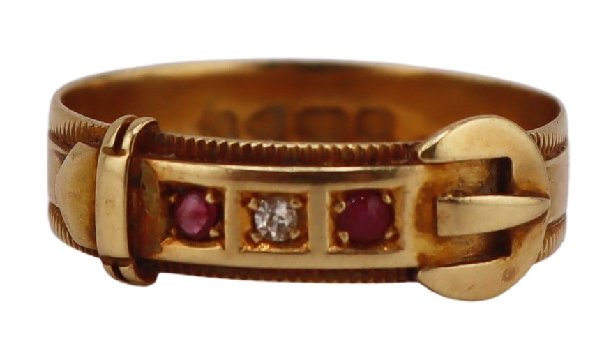 JEWELRY. English 18ct Gold, Ruby and Diamond Ring.: English 18ct yellow gold buckle form ring displaying (2) round faceted rubies flanking a single round faceted diamond. Stamped to the interior of the band, "18", Chester, 1907. Total approx. weight of