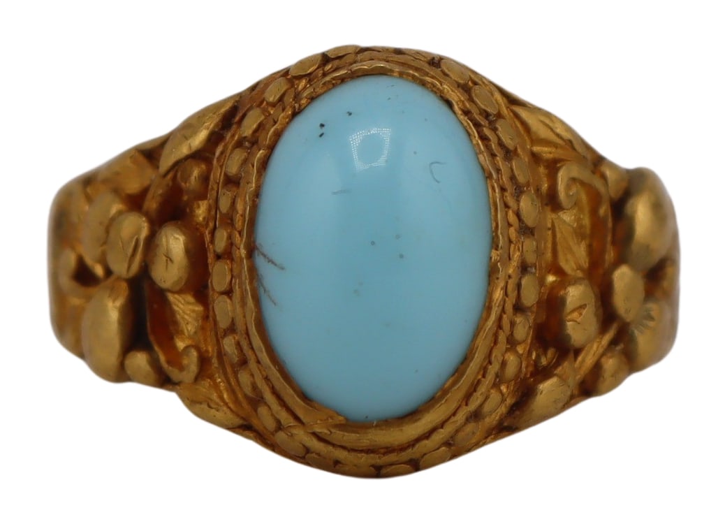 JEWELRY. Chinese High Karat Gold & Turquoise Ring.: Chinese high karat gold ring displaying a central oval turquoise cabochon with gold work accented by high relief foliate depictions. Stamped to the underside. Total approx. weight of the ring is 3.8 d