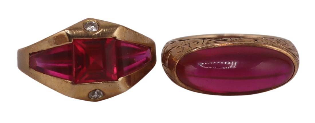 JEWELRY. (2) Signed Gold and Gem Cocktail Rings.: Particularly interesting and fabulous color combination. Includes an antique signed 10kt yellow gold ring with sugarloaf style pink-red gem cabochon with etched scroll work to the band - stamped, "A*"