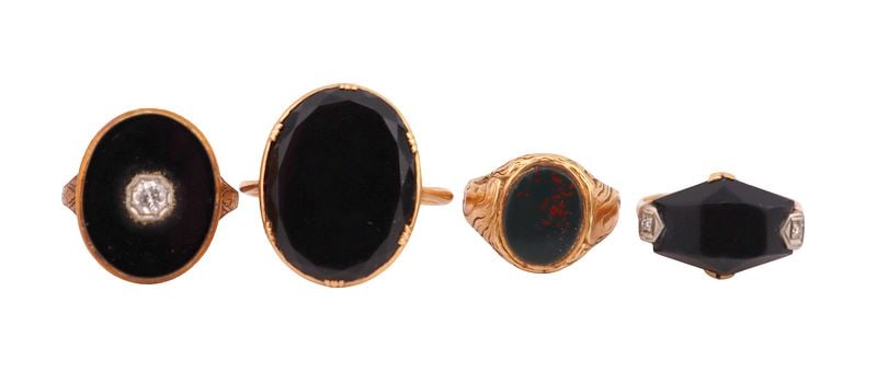 JEWELRY (4) Assorted 14kt and 18kt Gold Rings: Including an unmarked 14kt yellow gold ring with a central bezel-set bloodstone slice - stamped, "14K" size 3 1/2; a 14kt yellow gold ring with a central prong-set faceted onyx and two 14kt white gold
