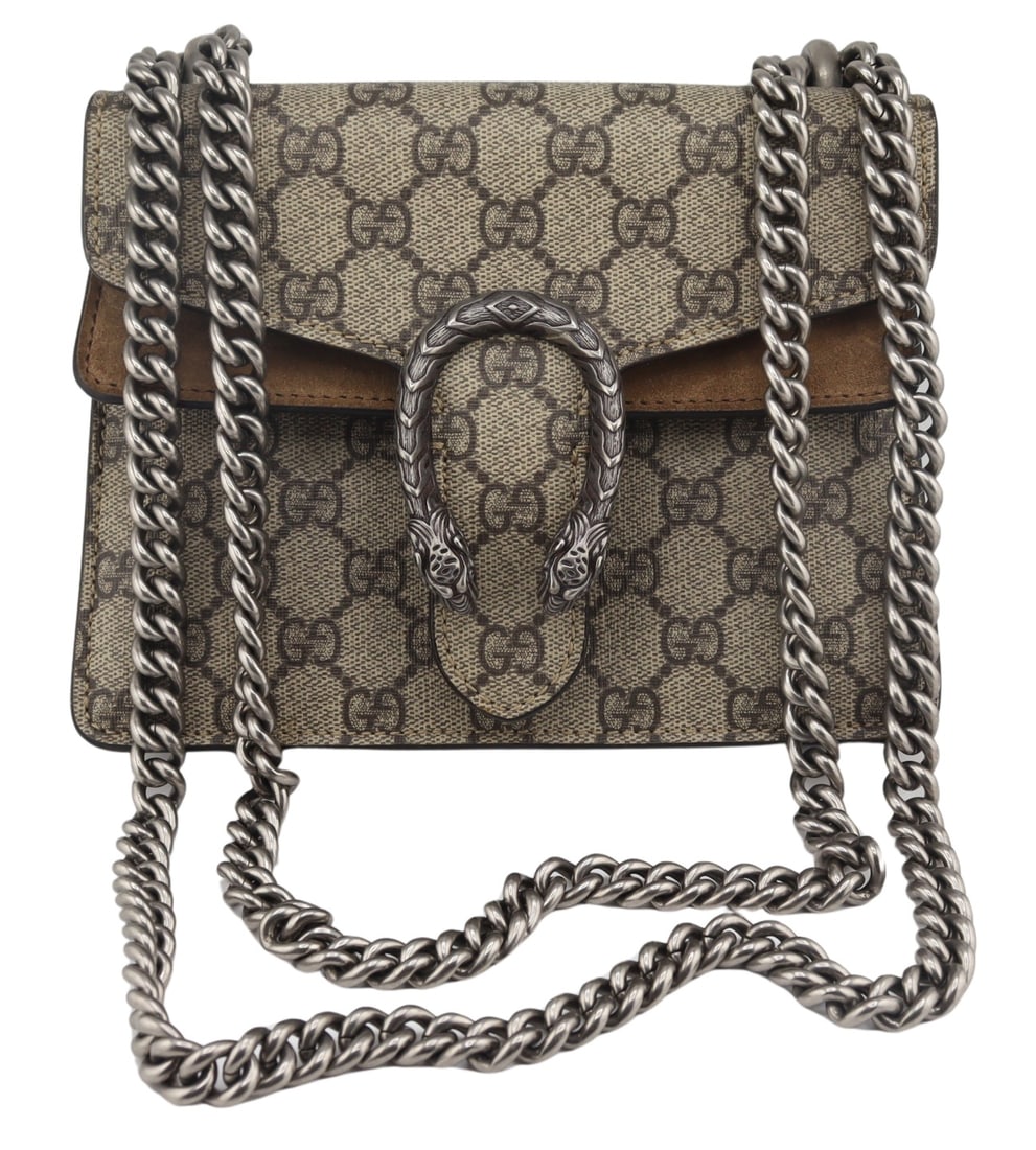 COUTURE. Gucci Mini Dionysus Shoulder Bag.: GUcci mini Dionysus monogrammed shoulder bag displaying beige monogrammed and suede panels with a foldover top. With a Dionysis plaque of a horseshoe form pendant terminating in two tiger's heads. Clo