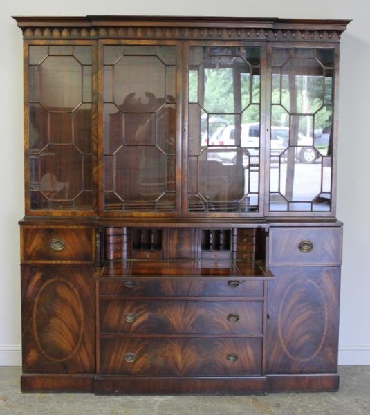 Custom Mahogany 2 Part Stepback Breakfront.: With fold down butlers desk. Banded inlay, nice molding detail, and flame grain mahogany. With keys, and adjustable shelves. From a Scarsdale, NY home. Dimensions: 72" w x 16.75" d x 84" h. Condition: