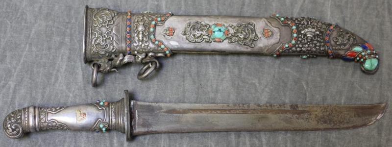 Antique Mediterranean Silver & Jeweled Dagger and: Scabbard. As Found. A beautiful weapon, unfortunately missing a piece from one side of scabbard. Dimensions: scabbard - 10.75," dagger - 13.25." Condition: Rust and slight pitting to blade, and a 6" x