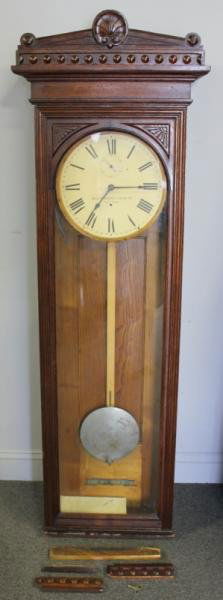 Large Oak Wall Clock.: By Self Winding Clock Co. New York. From a Mamaroneck, NY home. Dimensions: 21.25" w x 8.5" d x 64.25" h.