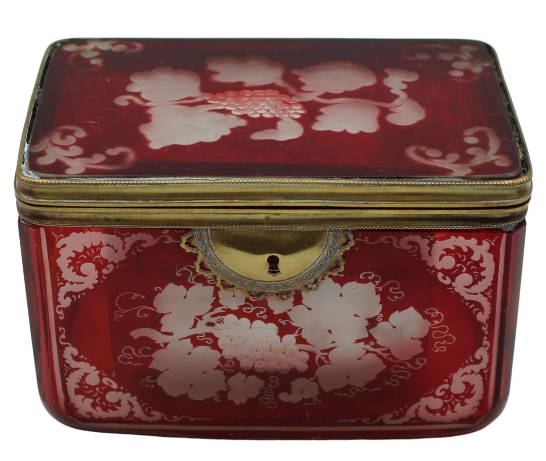 19th C Etched and Carved Ruby Red Box.: 19th C ruby red Bohemian etched and carved glass box with gilt-metal mounts around the edges and keyhole. From the estate of a 50+ year antique dealer specializing in decorative arts with an emphasis 