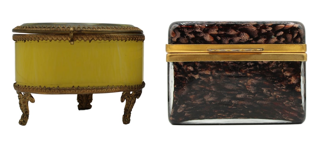 (2) Brass Mounted Glass Boxes.: Including a brass mounted circular form lemon yellow opaline glass box with clear glass lid on three legs; and a Murano gold stone rectangular form box. From the estate of a 50+ year antique dealer sp