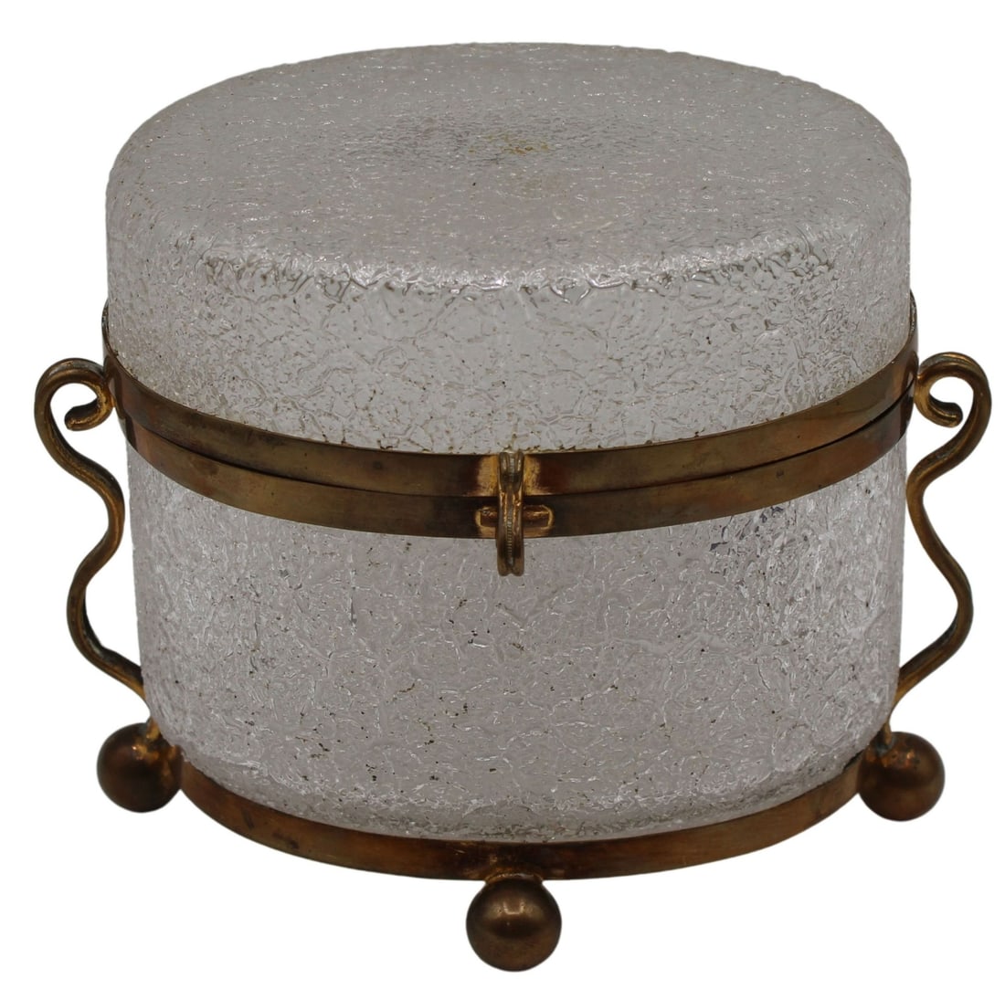 Pale Pink Opaline Glass Box with Gilt Bubbles.: and Flakes. Clear crackle glass oval form box with ball form feet and antique brass mounts. Engraved brass on interior edges of the box with s-style handles and latch. Small drill holes in each foot. 