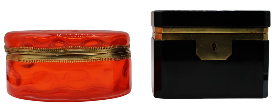 (2) Glass Boxes with Metal Mounts.: Including a round orange Murano glass box with gilded mounts; and a black opaline octagonal form glass box with brass mounts. From the estate of a 50+ year antique dealer specializing in decorative ar