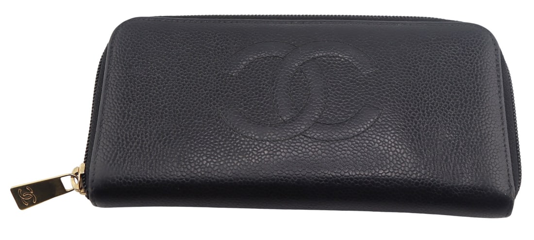 COUTURE. Chanel CC Black Caviar Leather Wallet.: Chanel CC black caviar leather zip around wallet with interior pockets. Inscribed, "Made in Italy" to the interior. Serial no. 9273953. From the estate of a 50+ year antique dealer specializ