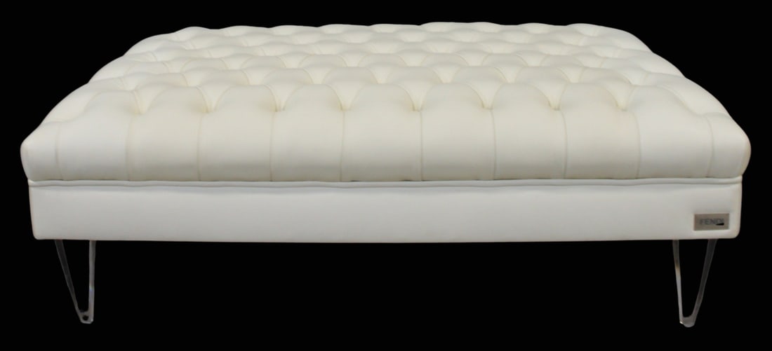 Fendi Suede Cloth Tufted Ottoman.: Fendi tufted suede cloth ottoman with lucite legs. With Fendi plaque on one side. From the estate of a 50+ year antique dealer specializing in decorative arts with an emphasis on Opaline glass boxes. 