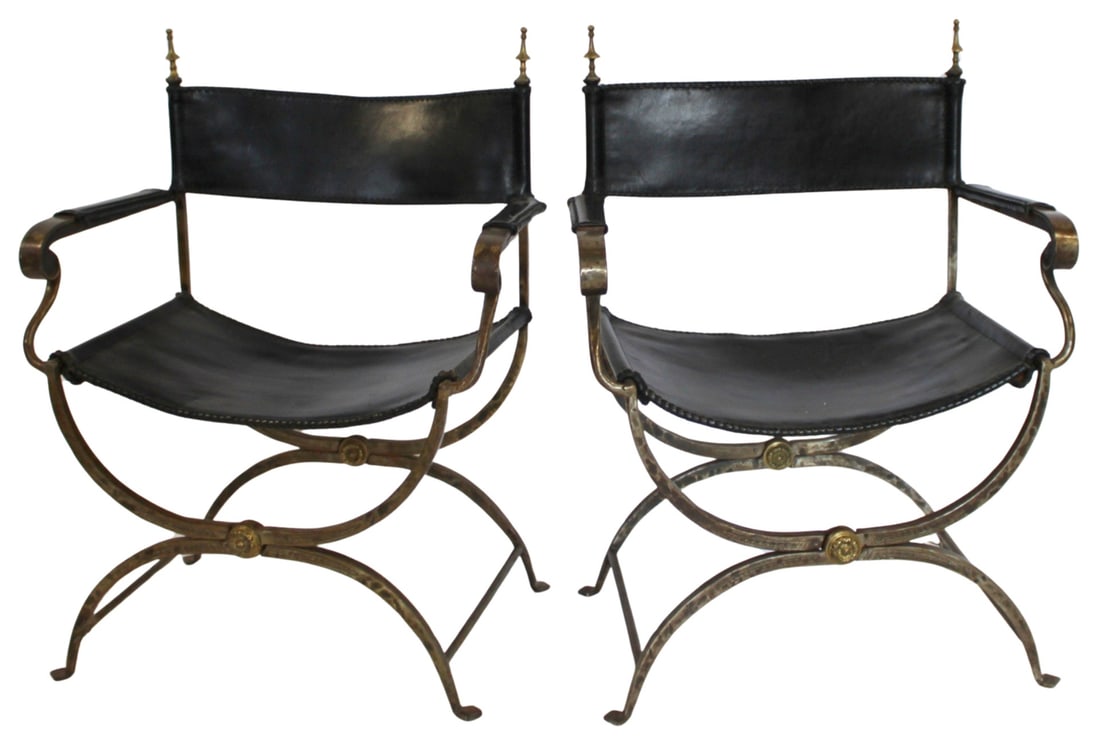 Pair of Antique Wrought Iron Savonarola Style: Chairs. Folding chairs with leather upholstery and thick hand wrought frame. From the estate of a 50+ year antique dealer specializing in decorative arts with an emphasis on Opaline glass boxes.