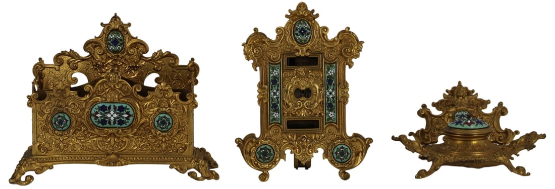 (3) Piece Enamel and Bronze Desk Set.: Including an inkwell with a glass insert in the middle displaying a floral, angelic, and scroll motif with floral enamel work on the lid; a pierced, 2-sectioned, document organizer decorated with flor