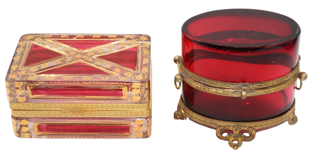 19th C Bronze Mounted Cranberry Glass Box and Red: to Clear Box with Gilt Decoration. Cranberry glass box with engraved bronze mounts with ball form side handles with an "s"-style clasp. Circa 19th century. A clear box flashed to red with ap