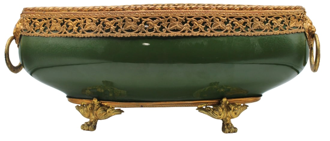 French Sarreguemines Gilt Metal Mounted Green: Porcelain Center Bowl or Jardiniere. With lion's head and ring handles, and set atop paw form feet. Stamped to the underside, "Sarreguemines France 3447 M 53 S". From the estate of a 50+ yea
