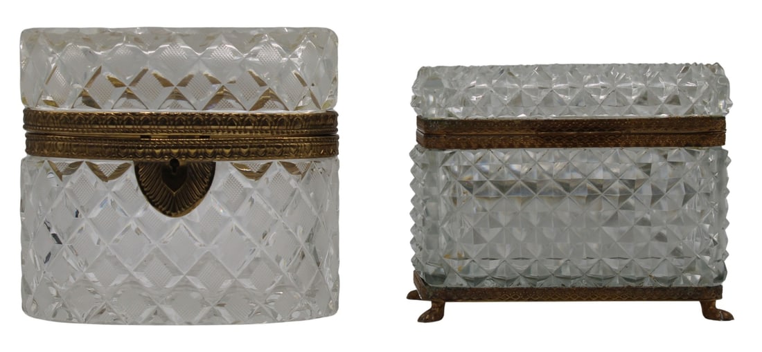 (2) Cut Glass Boxes with Gilt Metal Mounts.: Including a cut crystal box with engraved gilded bronze mounts & claw foot form feet; and an oval form cut glass box with engraved gilt metal mounts and a lock system. From the estate of a 50+ yea