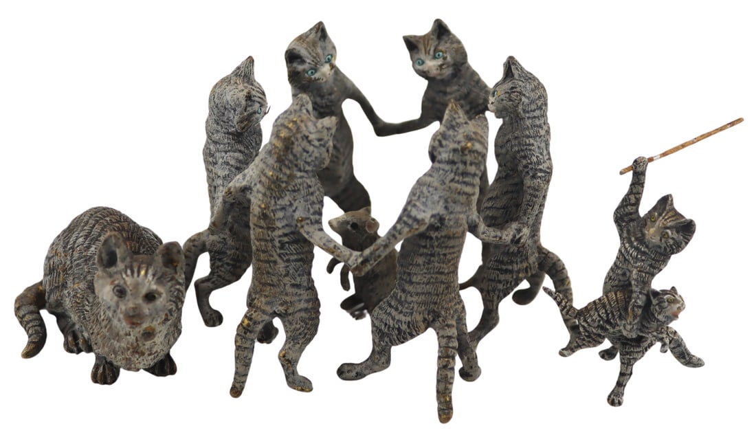 Austrian Cold Painted Bronze Cat Collection.: Includes an Austrian cold painted bronze crouching cat - stamped, "Austria" to the underside; a cold painted bronze figural grouping of a standing cat clutching a kitten under one arm and a