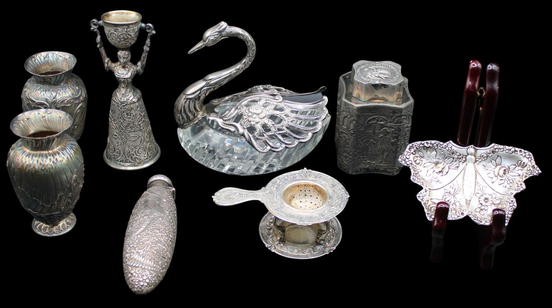 SILVER. Continental & American Sterling Objects.: Including (2) signed Pierre Queille 19th C with scroll work and floral motif small vase; a butterfly dish with a floral motif on its wings; a silverplate wedding cup of a woman in a scrollwork dress