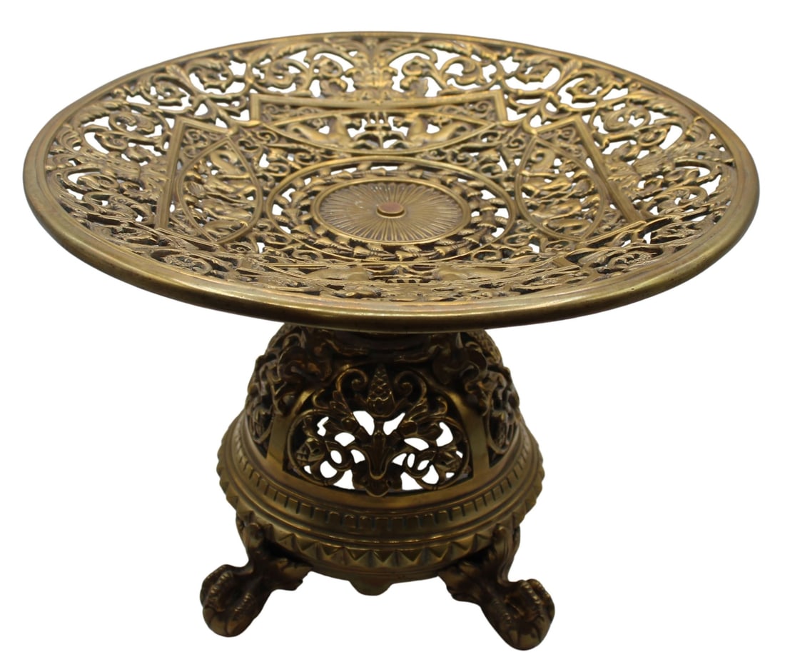 Antique Gilt Bronze Tazza with Ornate Pierced: Motif. Decorated throughout with ornate scrollwork, mermaids, and hippocamps. Set atop ball and claw feet. From the estate of a 50+ year antique dealer specializing in decorative arts with an emphasis