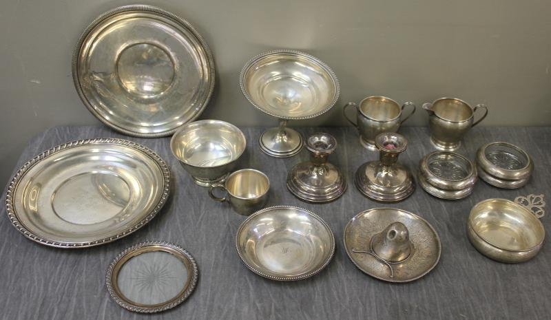 STERLING. Miscellaneous Hollowware Lot.: Includes 4 sterling coasters, 2 weighted candlesticks, a sterling child's cup, a sugar and creamer, a small sterling bowl, a Mexican sombrero, a weighted tazza, a single sterling and crystal coaster,