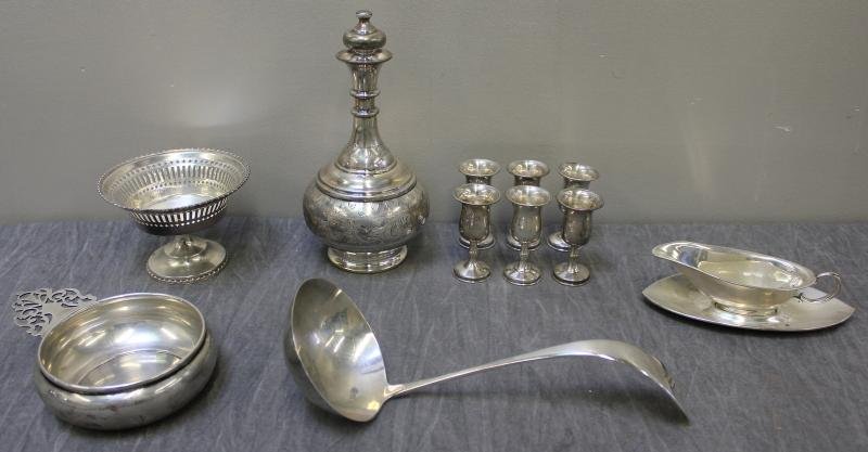 STERLING. Miscellaneous Hollowware Lot.: Includes a porringer, a Black Starr & Frost reticulated edge tazza, a large ladle, a small gravy boat with under plate, and a decanter with 6 cups. Total weight is approximately 26.16 troy oz. From a 