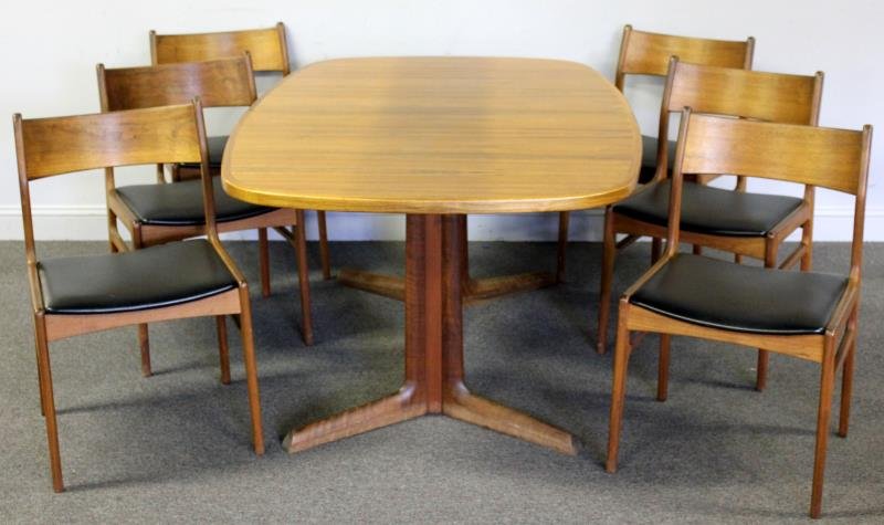 Midcentury Niels Moller Dining Table.: With a set of 6 Danish chairs labeled Funder-Shmidt & Madsen. Table labeled Gudme Mobelfabrik with Danish control label. From a Great Neck, NY estate. Dimensions: Table - 63" wide x 41.5" deep x 28.5"