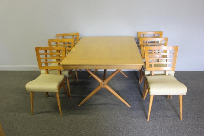 T.H. Robsjohn Gibbings Dining Table and Chairs.: Midcentury x-form base blonde wood table with 2 leaves together with 6 chairs. From an Armonk, NY estate. Dimensions: Table - 60" wide x40" deep, Chairs- 18" wide x 18" deep x 33.5" high. Condition: G