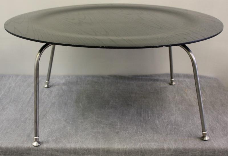 Midcentury Eames for Herman Miller "CTM" Table.: Round molded top with black aniline dye. Bent metal legs. Labeled Herman Miller on bottom. From a Newtown, CT home. Dimensions: 34" dia. x 15.25" high.