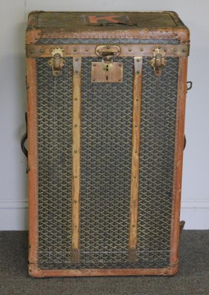 Vintage Goyard Traveling Trunk/Wardrobe. As is.: Labeled Goyard. From a Long Island, NY estate. Dimensions: 21" wide x 13" deep x 36" high. Condition: With some losses, scratches, and stains.