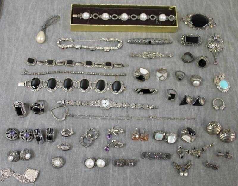 JEWELRY. Marcasite and Sterling Jewelry Group.: Includes a watch, 5 bracelets, 9 rings, 8 brooches, 17 earrings, 2 necklaces, and one misc pearl earring. Many beautiful pieces in this group include onyx, mother of pearl, mabe pearls, turquoise, and