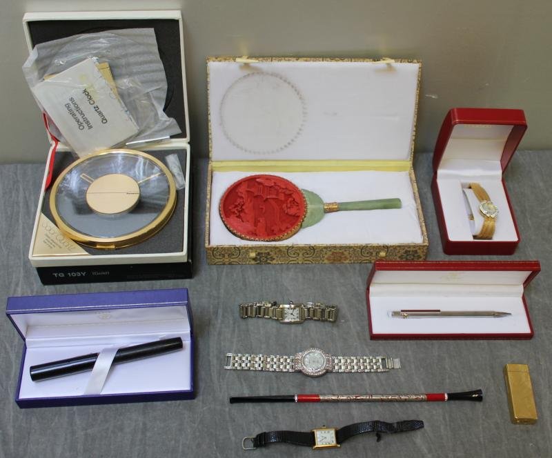 Miscellaneous Grouping.: Includes an oversized Waterman pen, a modern Cartier pen, a Cartier watch, a Cartier lighter, a cigarette holder, and a Chinese jade and cinnabar mirror. From a Manhattan, NY estate.