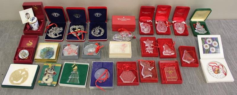 Baccarat, Lalique, Daum Nancy Ornament Lot.: Includes 2 Lalique, 1 Daum Nancy, 3 Arthur Court, 6 Baccarat, 5 Waterford, a Danish snowman, an Orrefors tree, a Neiman Marcus cherub, a Hutschenreuther, 1 Persian cat, and a B&G ornament. With 2 Staf