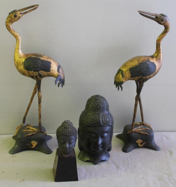 Antique Asian Lot.: Includes a pair of patinated and gilded iron cranes, and two early Buddha heads. The larger with an old collection label. From a Westchester, NY home. Dimensions: cranes - 18.25" h, large Buddha bust