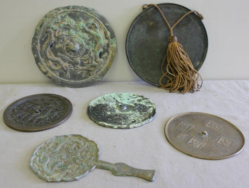 Antique Asian Bronze Hand Mirror Lot.: Includes 19th century or older. Two with old collections numbers. From a Massachusetts estate. Dimensions: Largest - 8.25" diameter.
