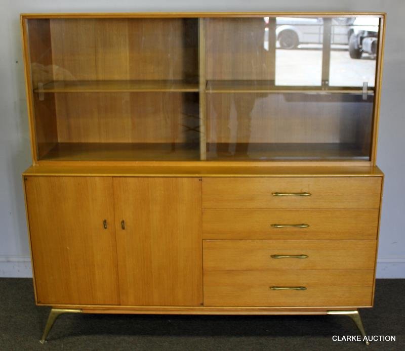 Midcentury Blondewood Credenza on Brass Legs.: Nice form with glass sliding door cabinet with shelf above drawer and door lower cabinet. "R-Way" paper label on back. From a Massachusetts estate. Dimensions: 59" w x 19" d x 57" h. Condition: Good u